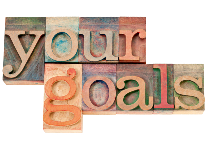 your goals - isolated words in vintage letterpress wood type stained by color inks